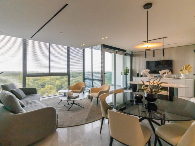 Image of living area with couch, chairs, table and chairs in this condo for sale in The Ivy