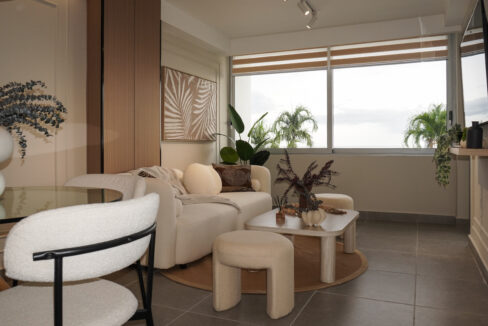 Image of living dining area with table and chairs in this condo for sale in The Palms