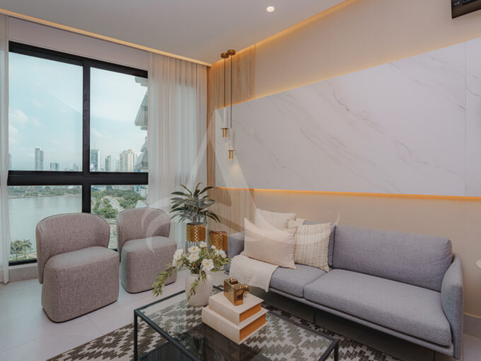 Image of living area with couch and two chairs in this condo for sale in Aquapoint