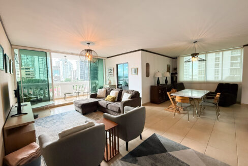 Image of living area with couch and balcony in this condo for sale in Da Vinci