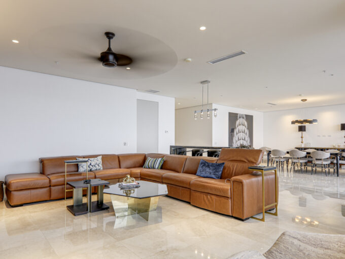 Image of living room with couch and table in this condo for sale in Matisse