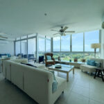 Image of living room with furniture and window in this condo for sale in Coronado Bay