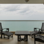 Balcony with ocean views in this condo for sale in Biltmore